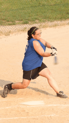 Softball player wearing loose-fitting clothing