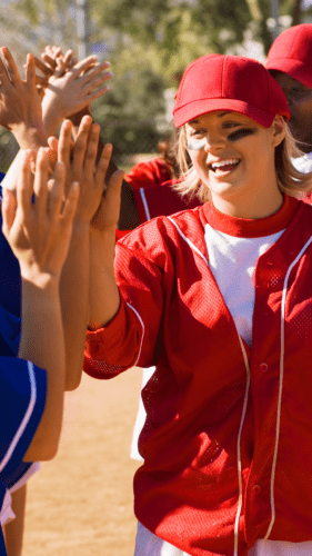 softball teams giving each other high fives