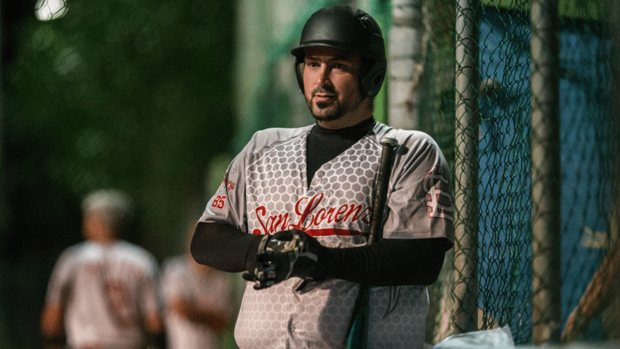 Man on deck for a slowpitch league with well-done uniforms